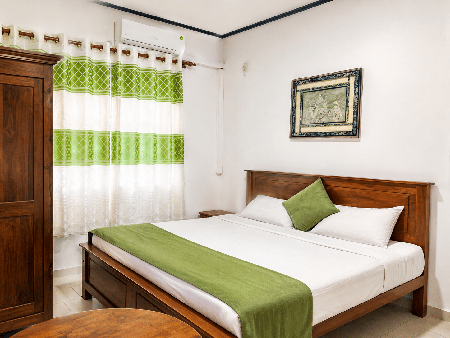 Bedroom with wooden bed, green accents, and air conditioning