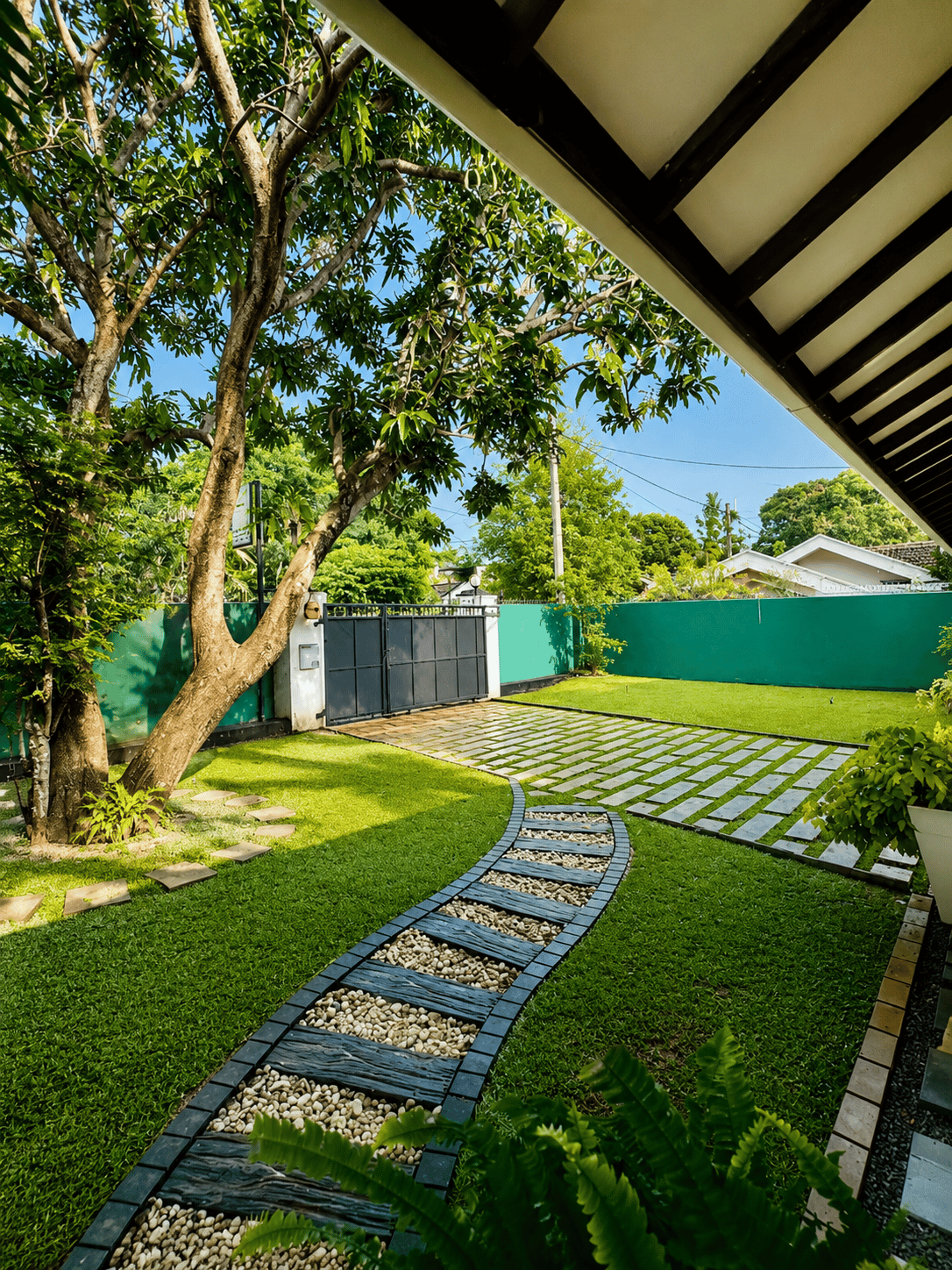 Private garden path and gated lawn