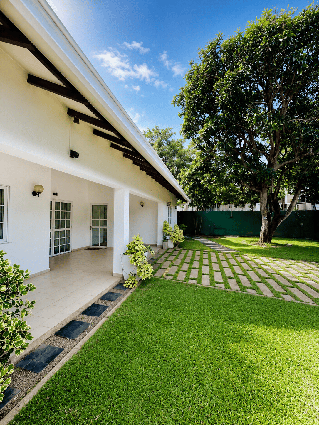 Villa veranda and garden lawn