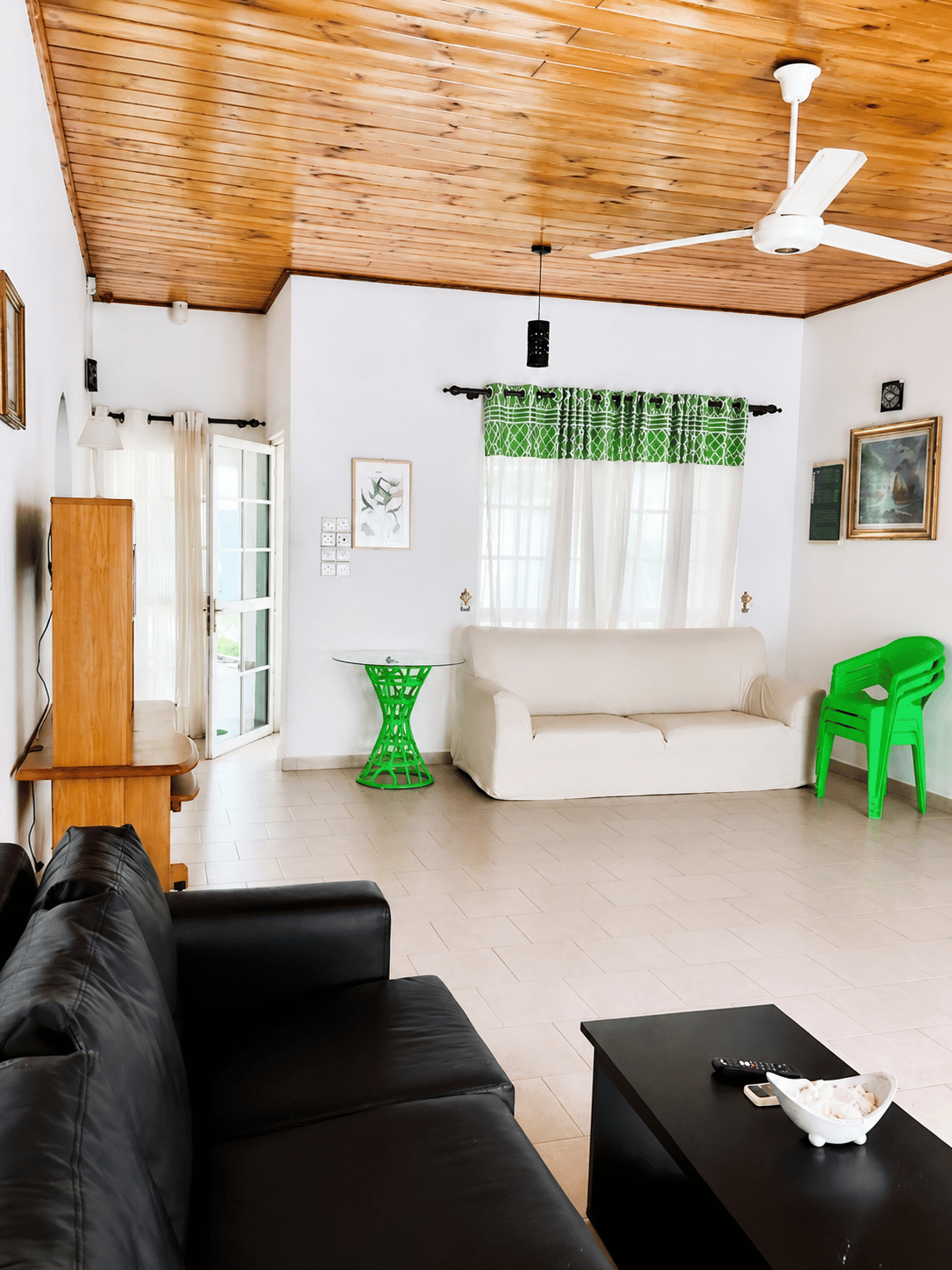 Living room with sofa seating and wood ceiling