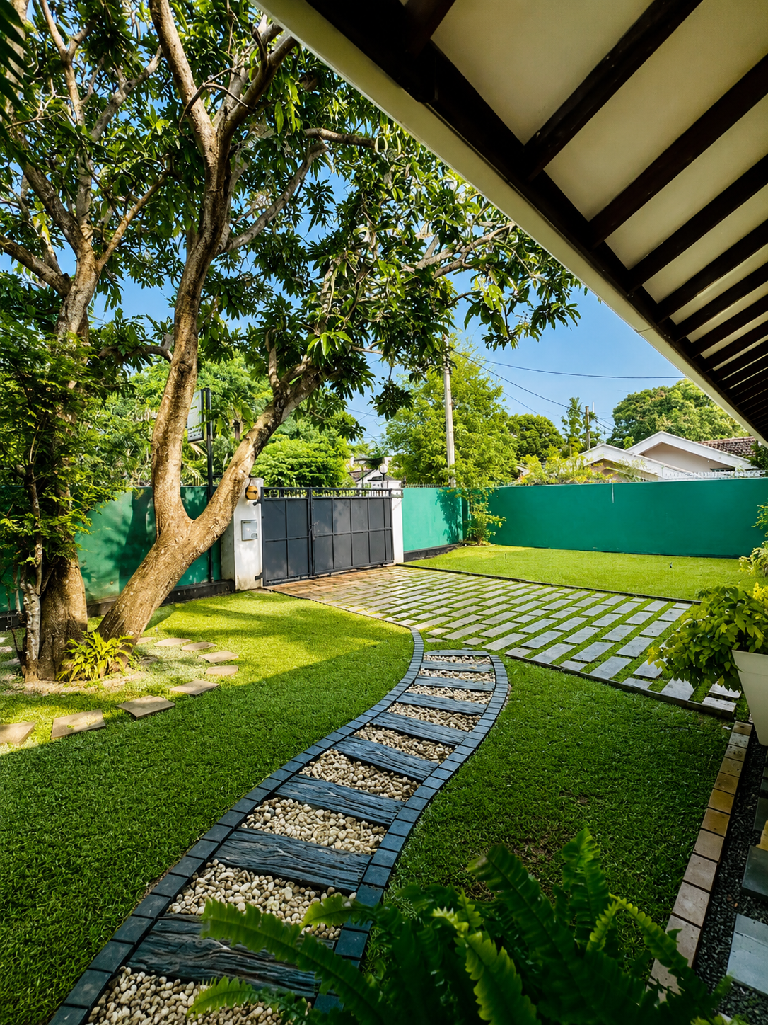 Private garden path and gated lawn